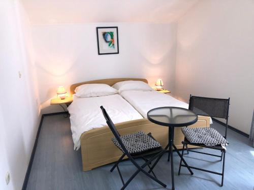 Postel nebo postele na pokoji v ubytování Blue Line Ferienappartement Mit Balkon