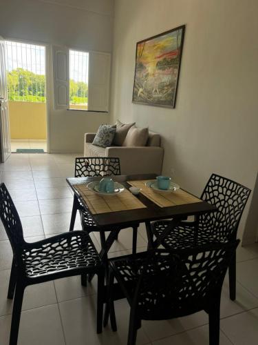 a living room with a table and chairs and a couch at ORLA FLAT - Apartamento 02 in Bragança
