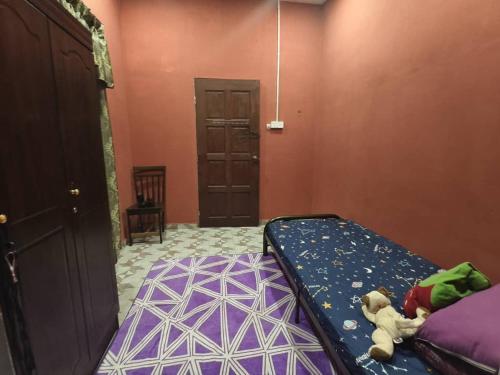 Postel nebo postele na pokoji v ubytování Homestay ujang