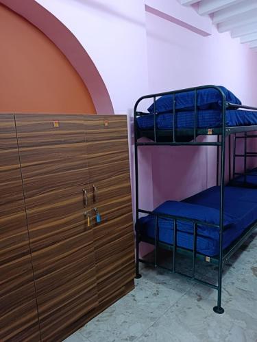 Ένα ή περισσότερα κρεβάτια σε δωμάτιο στο Le Apex Hostel