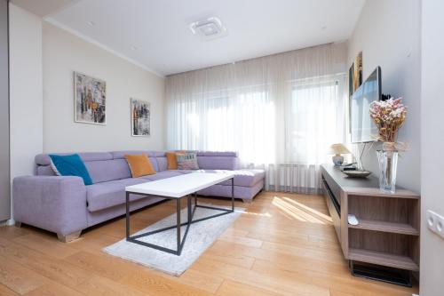 a living room with a couch and a table at Sanja & Mirza Apartments - Old Town Sarajevo in Sarajevo