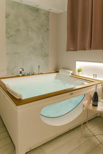 a bath tub in a bathroom with a large tub at Signorino Eco Resort & Spa in Marsala