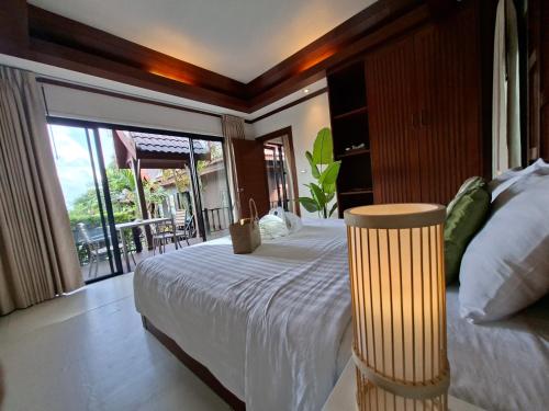 Postel nebo postele na pokoji v ubytování Kaya Mani Villas