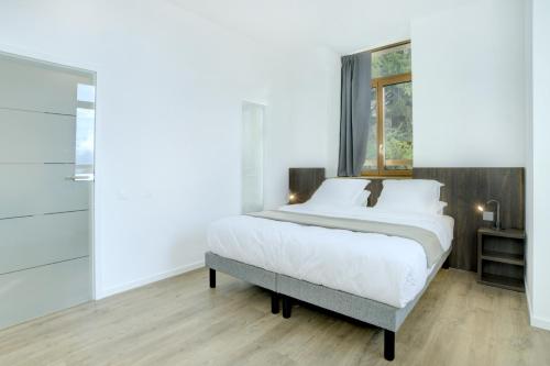 Voodi või voodid majutusasutuse Auberge de Morcles toas