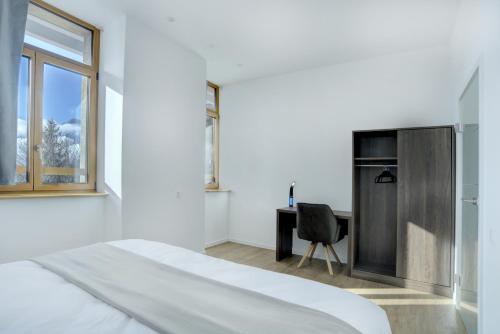 Voodi või voodid majutusasutuse Auberge de Morcles toas