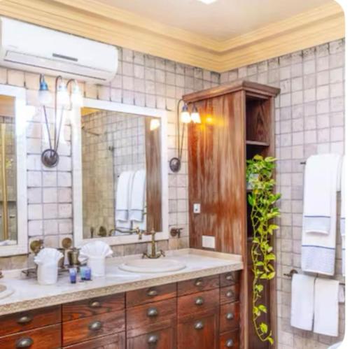 a bathroom with a sink and a mirror at Luxury Stay Villa de Caesarea in Caesarea