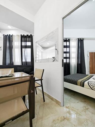 a bedroom with a bed and a desk and a desk at Travelers Nest in Safi