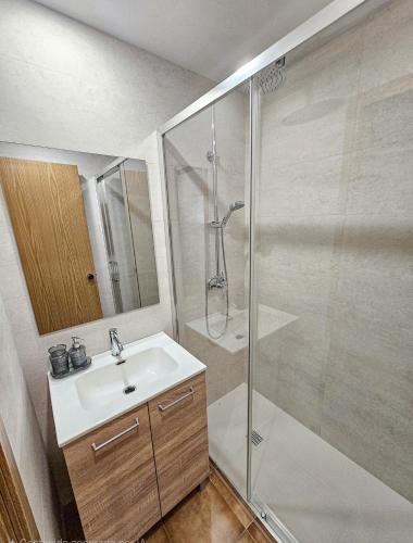 a bathroom with a sink and a shower at Kyra-Apartaments FronteraBL HUT2-6074 in Pas de la Casa