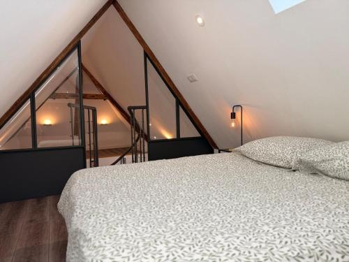 En eller flere senge i et værelse på La cotonnade - Entre vignes et ville