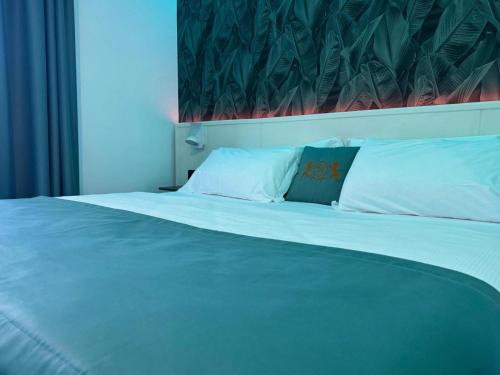 Postel nebo postele na pokoji v ubytování Hotel Max