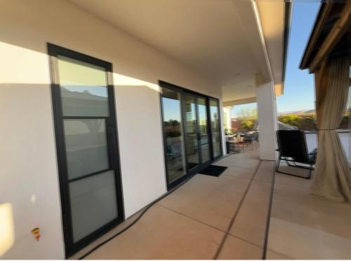 a hallway of a house with sliding glass doors at Luxe relax in Washington