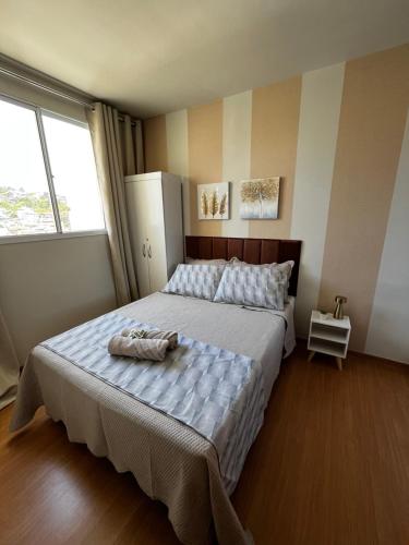 Giường trong phòng chung tại Refúgio tranquilo no coração de São Pedro