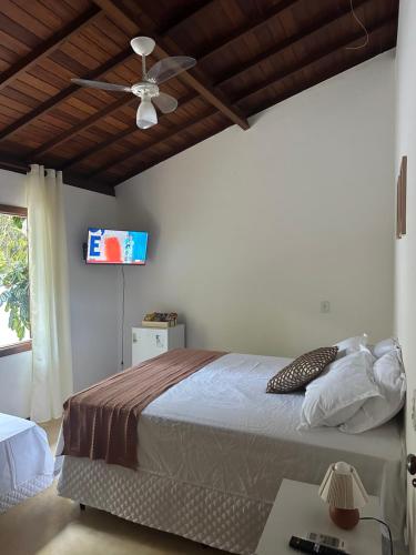 Giường trong phòng chung tại Pousada ViniCarmel Arraial D'ajuda