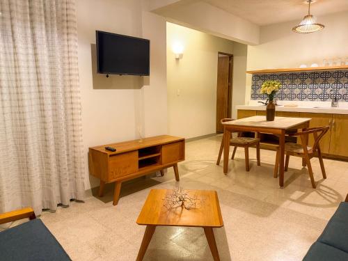 a living room with a couch and a table at Casa Carteros in Oaxaca City