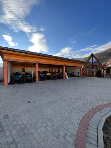 a building with motorcycles parked inside of it at Forest Property in Hăghiac