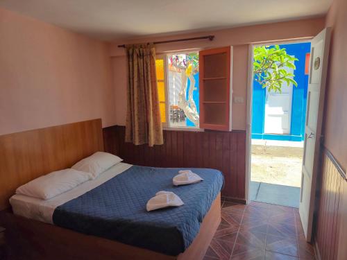 Postel nebo postele na pokoji v ubytování Illariy Wasi Hostal