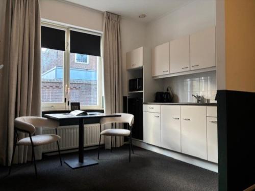 Kuchyň nebo kuchyňský kout v ubytování In de Kathoek - Beste voorwaarden via eigen kanaal