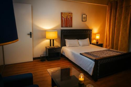 Ένα ή περισσότερα κρεβάτια σε δωμάτιο στο Secure Central Room Diplomatic Enclave, Islamabad