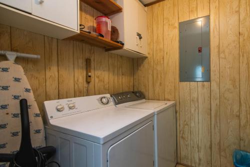 a small kitchen with a washing machine in it at Sea Breeze in Edisto Island