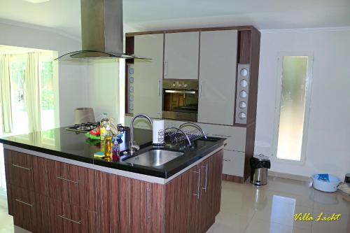 a kitchen with a sink and a counter top at Villa Licht, Obligado Center in Obligado