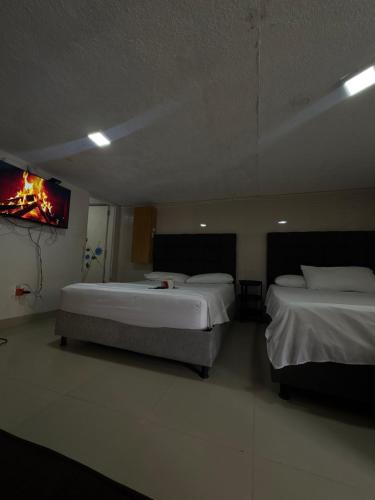 En eller flere senge i et værelse på Habitación corales cerca al mar