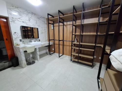 a bathroom with a sink and a toilet and a mirror at suites vergel planta alta in Orizaba