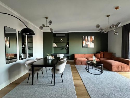 a living room with a table and a couch at Taksim Lagirio Residence in Istanbul