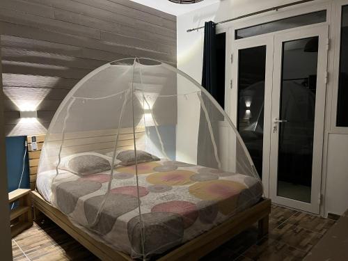 a bedroom with a bed in a glass dome at Cap Lodge in Le Marin