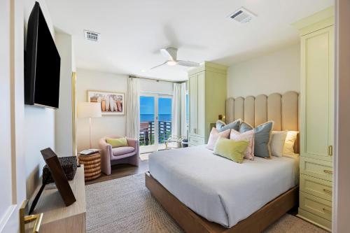 a bedroom with a large bed with a view of the ocean at WS4456: 4456 Windswept in Kiawah Island