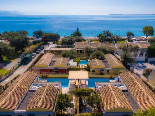 an aerial view of a resort with the ocean in the background at Barbati Beach - Villa Lefkada in Barbati