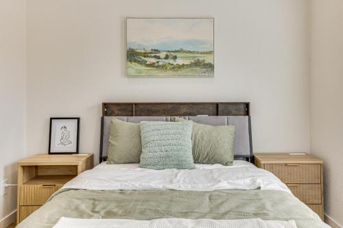 a bedroom with a bed with two night stands at Great for Travel Nurses 2BR East Dallas Townhome! in Dallas