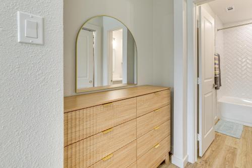 a bathroom with a wooden dresser with a mirror at Great for Travel Nurses 2BR East Dallas Townhome! in Dallas