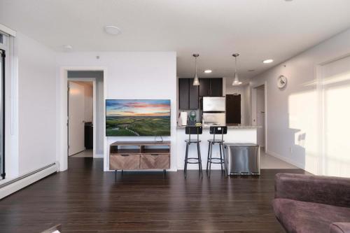 Et tv og/eller underholdning på Luxury Apartment in Central Location with Pool Jacuzzi & Sauna