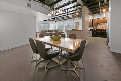 a dining room table and chairs in a room at 3 BR 2 BA Downtown Loft water view in Fort Walton Beach