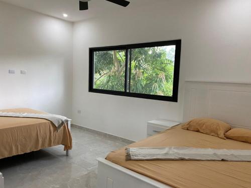 Ένα ή περισσότερα κρεβάτια σε δωμάτιο στο Steps to Ballenas beach, very private pool