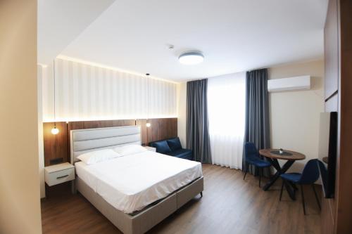 Ένα ή περισσότερα κρεβάτια σε δωμάτιο στο Sirion Apartments