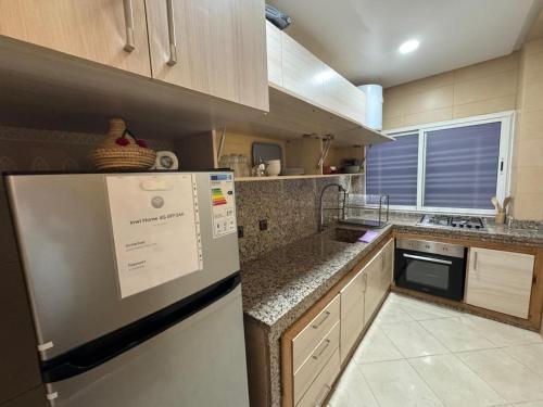 Kuchyň nebo kuchyňský kout v ubytování bel appartement