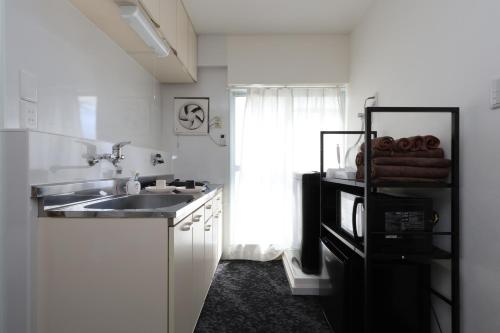 Η κουζίνα ή μικρή κουζίνα στο 森下ビル302