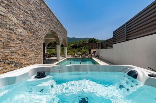 a swimming pool in the middle of a building at Villa Eden with heated pool in Omiš