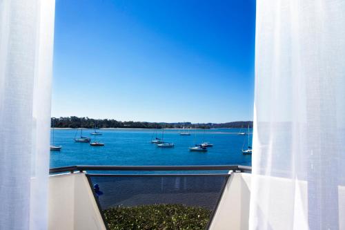 a view of a body of water with boats at The Esplanade Motel in Batemans Bay