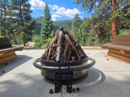 a pile of logsigunigunigunigunigunigunigunigun at Cabin 1- Hot Tub Grill- Mins to RMNP in Estes Park