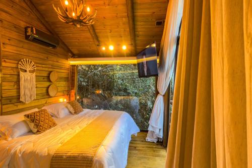 Postel nebo postele na pokoji v ubytování Cabana da mata