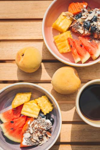 a wooden table with three bowls of food on it at Casa Cedrela Hotel Boutique -Cauca Viejo- Mayores de 14 años in Jericó