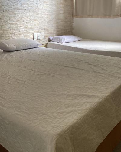 Postel nebo postele na pokoji v ubytování Quartos em pousada disponivel na praia do futuro