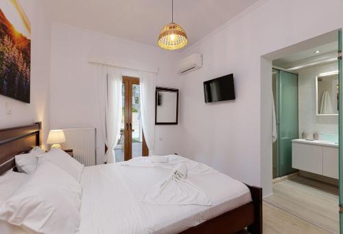 Ένα ή περισσότερα κρεβάτια σε δωμάτιο στο Kampos Villa Iii