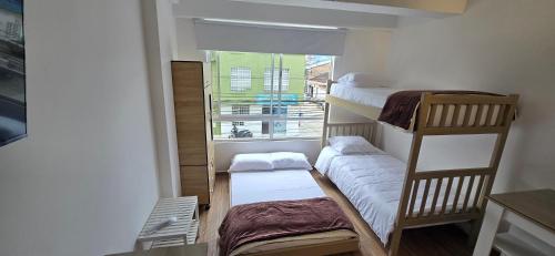 Ένα ή περισσότερα κρεβάτια σε δωμάτιο στο Central y acogedor apartaestudio en Pitalito