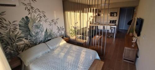 En eller flere senge i et værelse på Studio Bliss