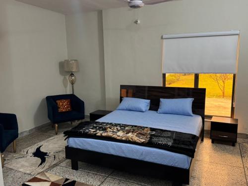 Ένα ή περισσότερα κρεβάτια σε δωμάτιο στο Amberwood residency