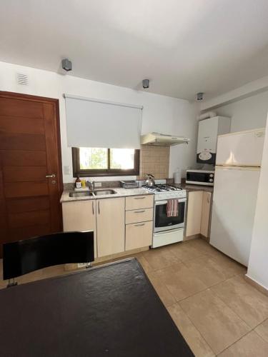 Køkken eller tekøkken på Complejo Agapanto