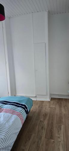 En eller flere senge i et værelse på Maison typique Nord de la France